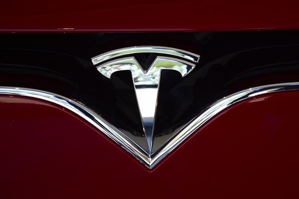 The Tesla brand logo on one of the company's cares. 